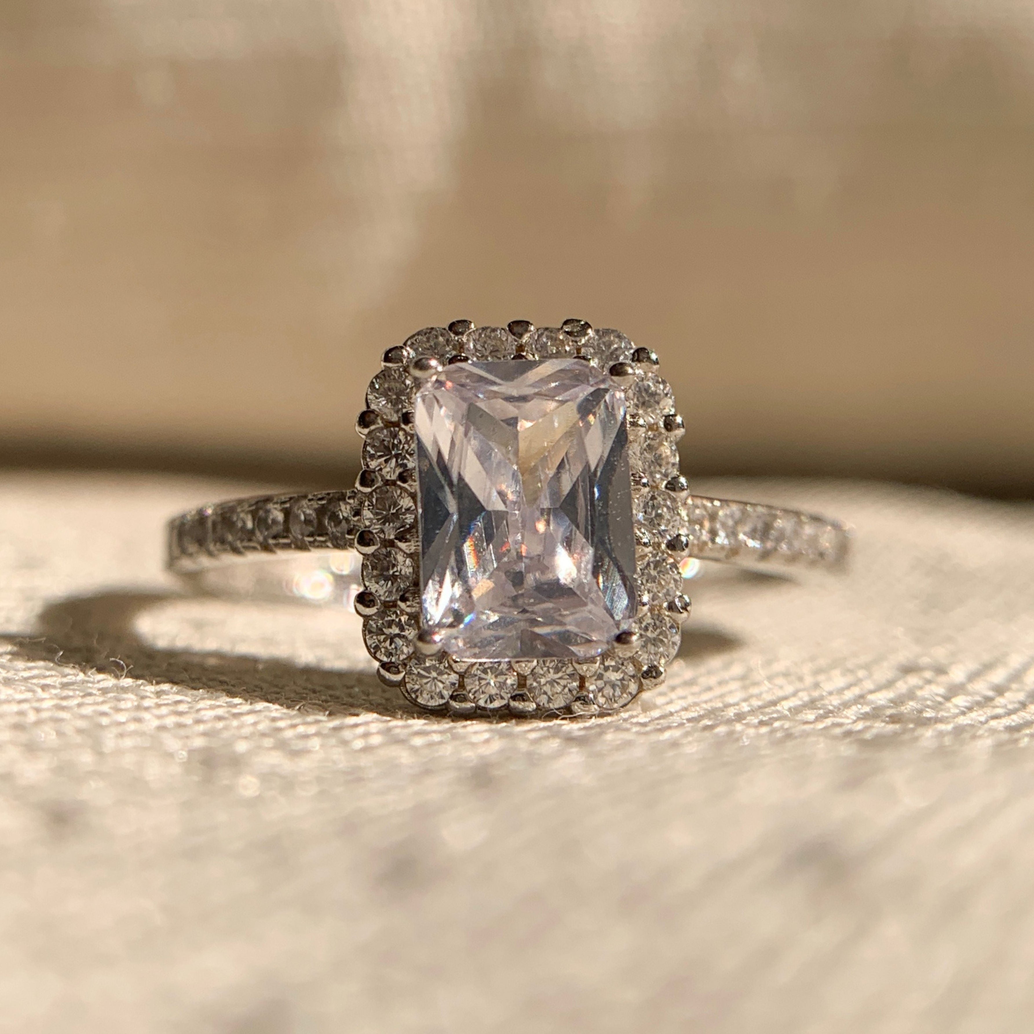 "1.00 Ct Radiant Cut Halo Engagement Ring in white gold with sparkling diamonds"